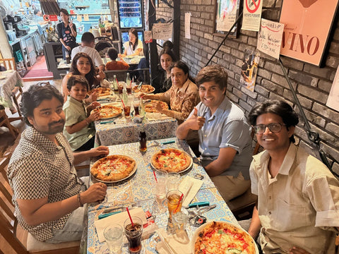 friends enjoying pizza lunch in uji, japan on a beyond tokyo journey