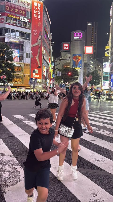 Mother and Child taking a picture at Shibuya, Tokyo, Japan on a beyond tokyo journey
